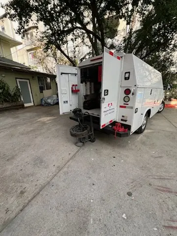 Magnet Plumbing service vehicle on-site for Grease Trap Cleaning in Bonita Springs